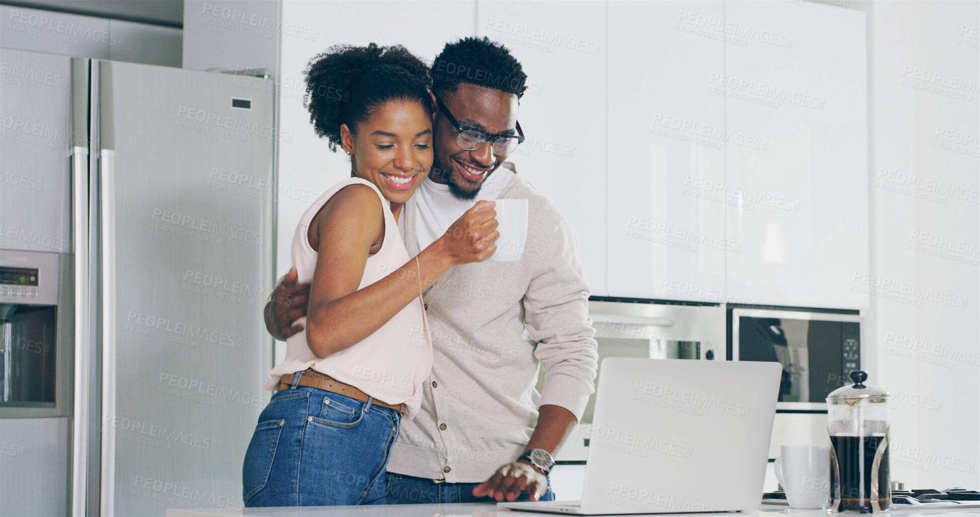 Buy stock photo Couple, laptop and coffee in kitchen with hug for support, remote work and connection in home. African people, happy and embrace in house for bonding, online shopping and ecommerce with budget review