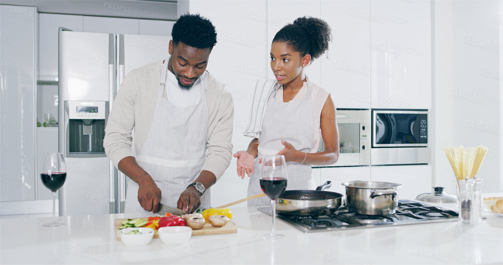 Buy stock photo Couple, kitchen and cutting vegetables with wine glasses on conversation, bonding and love. Home, people and relationship with cooking for meal prep, romantic dinner and nutrition for valentines day 