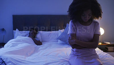 Buy stock photo Sad, woman and bed with African couple, night and marriage problem from infertility with stress from fight. Bedroom, sitting and thinking of divorce and relationship conflict at home with insomnia