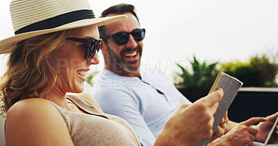 Buy stock photo Outdoor, couple and laughing with book reading in garden for funny story, novel and comedy. Home, people and happy or smile in relationship for bonding, support and care or trust with information