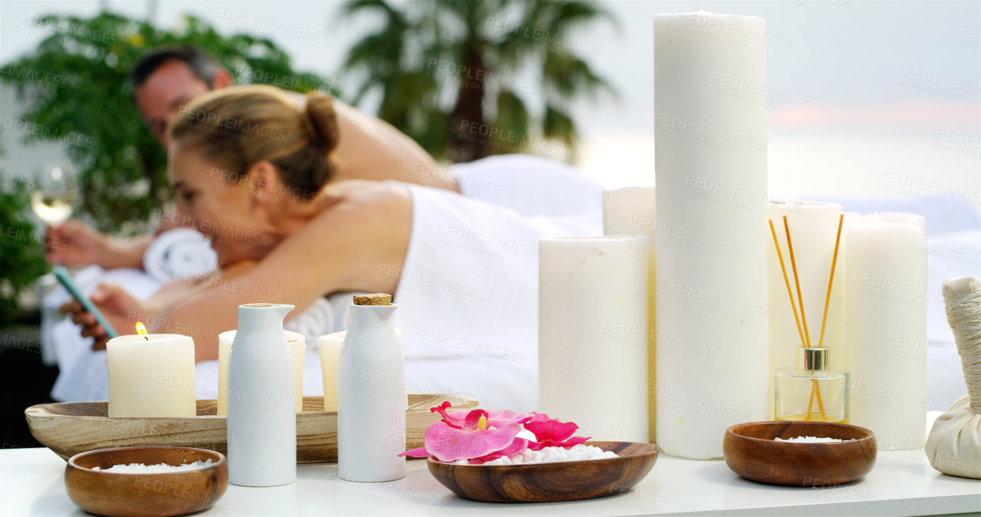 Buy stock photo Couple, candle and aroma with relax at spa for vacation, holiday or honeymoon at luxury resort. Man, woman or people in relaxation with essence, therapy or zen for beauty treatment at outdoor salon