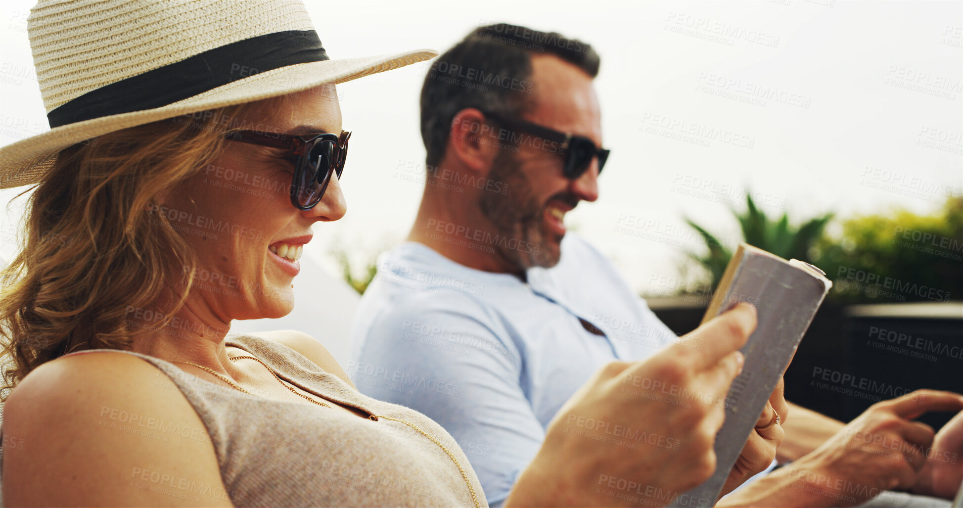 Buy stock photo Relax, couple and reading book with vacation, happiness and bonding together with summer holiday. Outdoor, man and woman with novel, literature and valentines day with weekend break and anniversary