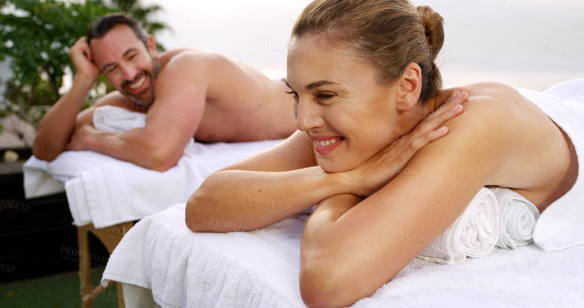 Buy stock photo Massage, relax and smile with couple at spa together for holistic or stress relief treatment. Health, luxury or wellness with happy man and woman on table at beauty salon or resort for satisfaction