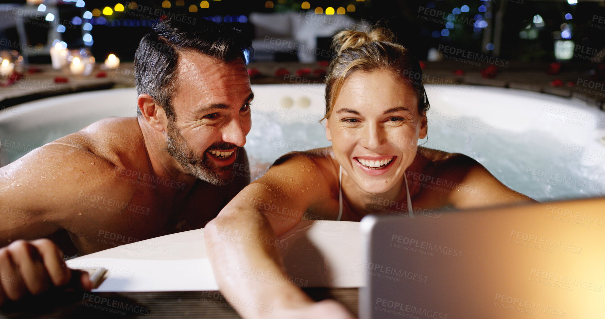 Buy stock photo Couple, hot tub and selfie with tablet, relax and excited for holiday, love or post on web at luxury resort. Woman, man and memory with smile, app and connection with profile picture for social media