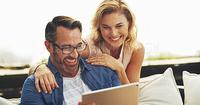 Buy stock photo Tablet, relax and mature couple in home planning romantic vacation, holiday or getaway together. Happy, digital technology and people on sofa in living room for booking hotel reservation at house.