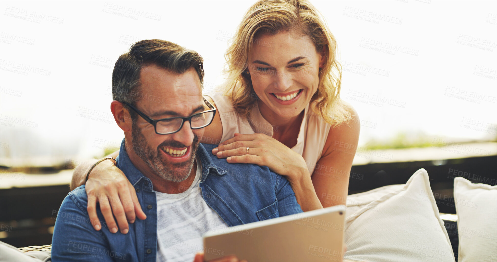 Buy stock photo Tablet, relax and mature couple in home planning romantic vacation, holiday or getaway together. Happy, digital technology and people on sofa in living room for booking hotel reservation at house.