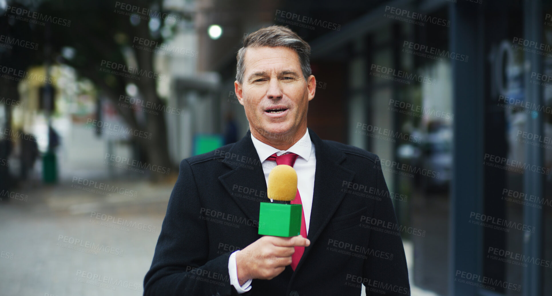 Buy stock photo Outdoor, portrait and man with microphone for broadcast, information and press update to public. News report, mature journalist and feedback in city for speech, briefing facts and business reporter