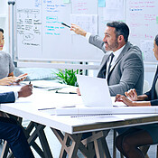 Teamwork, charts and business people in meeting, finance and review ...