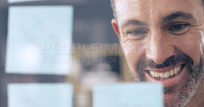 Buy stock photo Face, glass and smile with business man in office for brainstorming or planning mindmap closeup. Problem solving, sticky notes and window with happy employee in workplace for company development