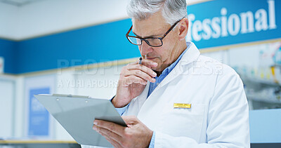 Buy stock photo Mature man, doctor and thinking with clipboard for medical study, research or prescription at pharmacy. Male person, pharmacist or healthcare employee in wonder for new medication or drug trial