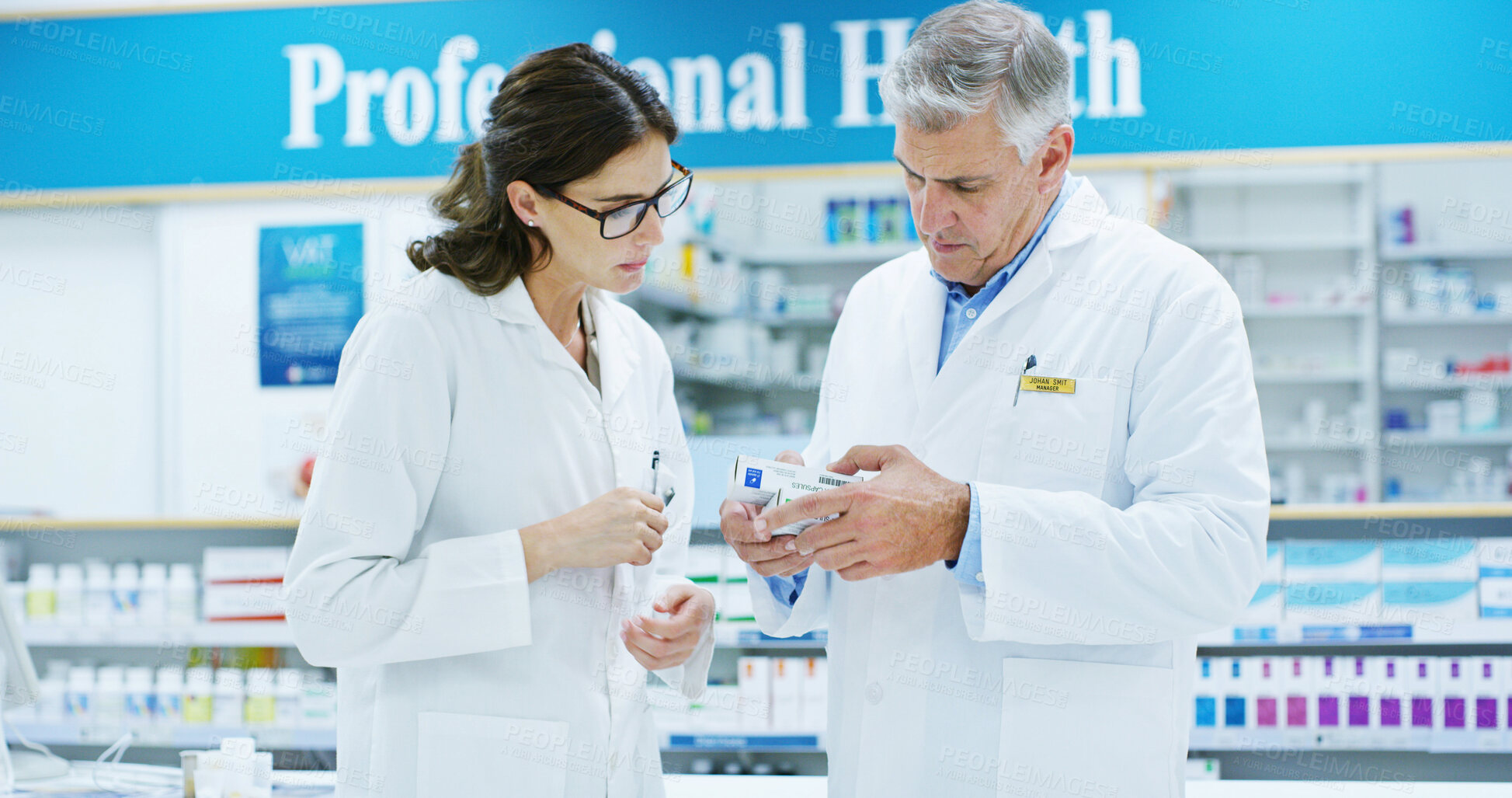 Buy stock photo Box, conversation and healthcare with people in pharmacy together for medical discussion. Conversation, information or prescription with pharmacist man and woman in clinic for retail wellness