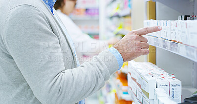 Buy stock photo Person, hands and pharmacy with shelf for medication, symptoms or side effects at dispensary. Closeup, patient or client pointing for selection, choice or pick for health supplements at drug store