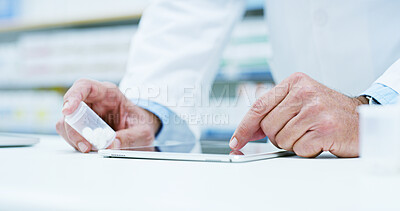 Buy stock photo Doctor, hands and tablet with pills for medical research, side effects or symptoms at pharmacy. Closeup, pharmacist or healthcare worker with technology or medication for pharmaceutical information