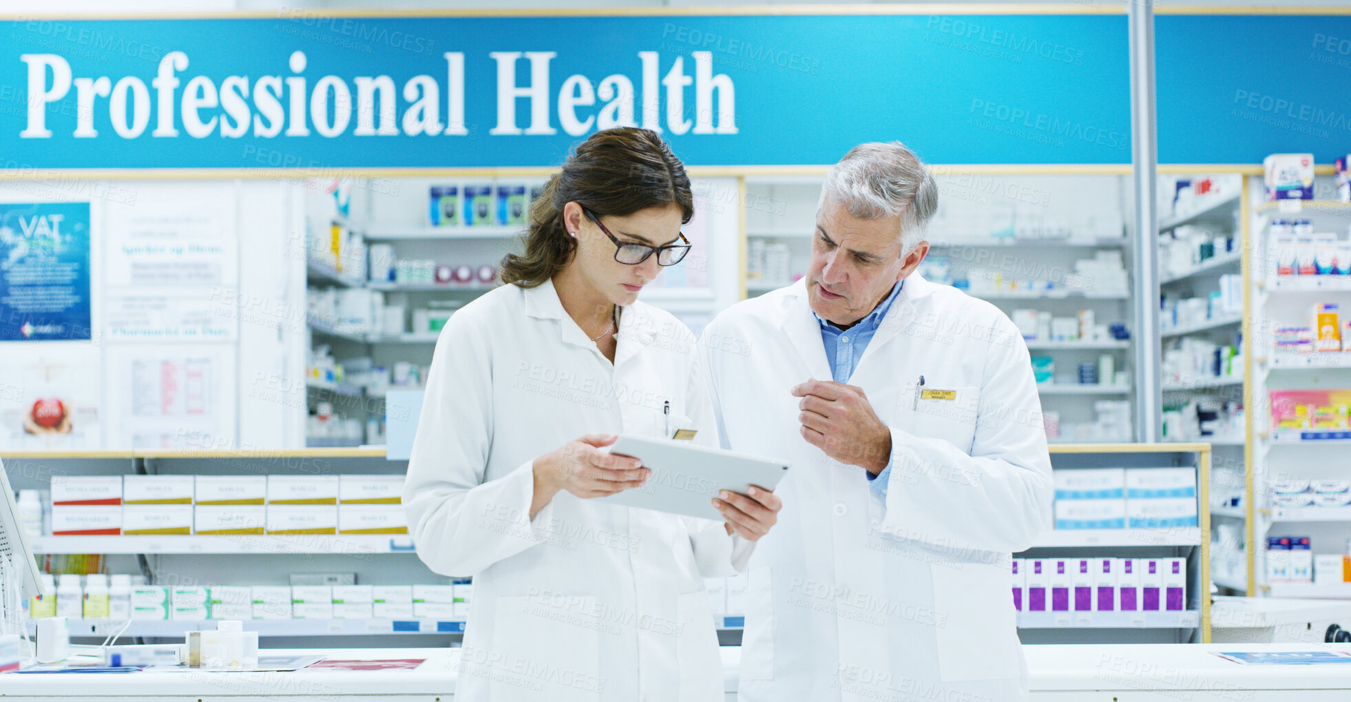 Buy stock photo Collaboration, conversation and tablet with people in pharmacy together for medical discussion. Healthcare, information or research with pharmacist man and woman in clinic for retail wellness