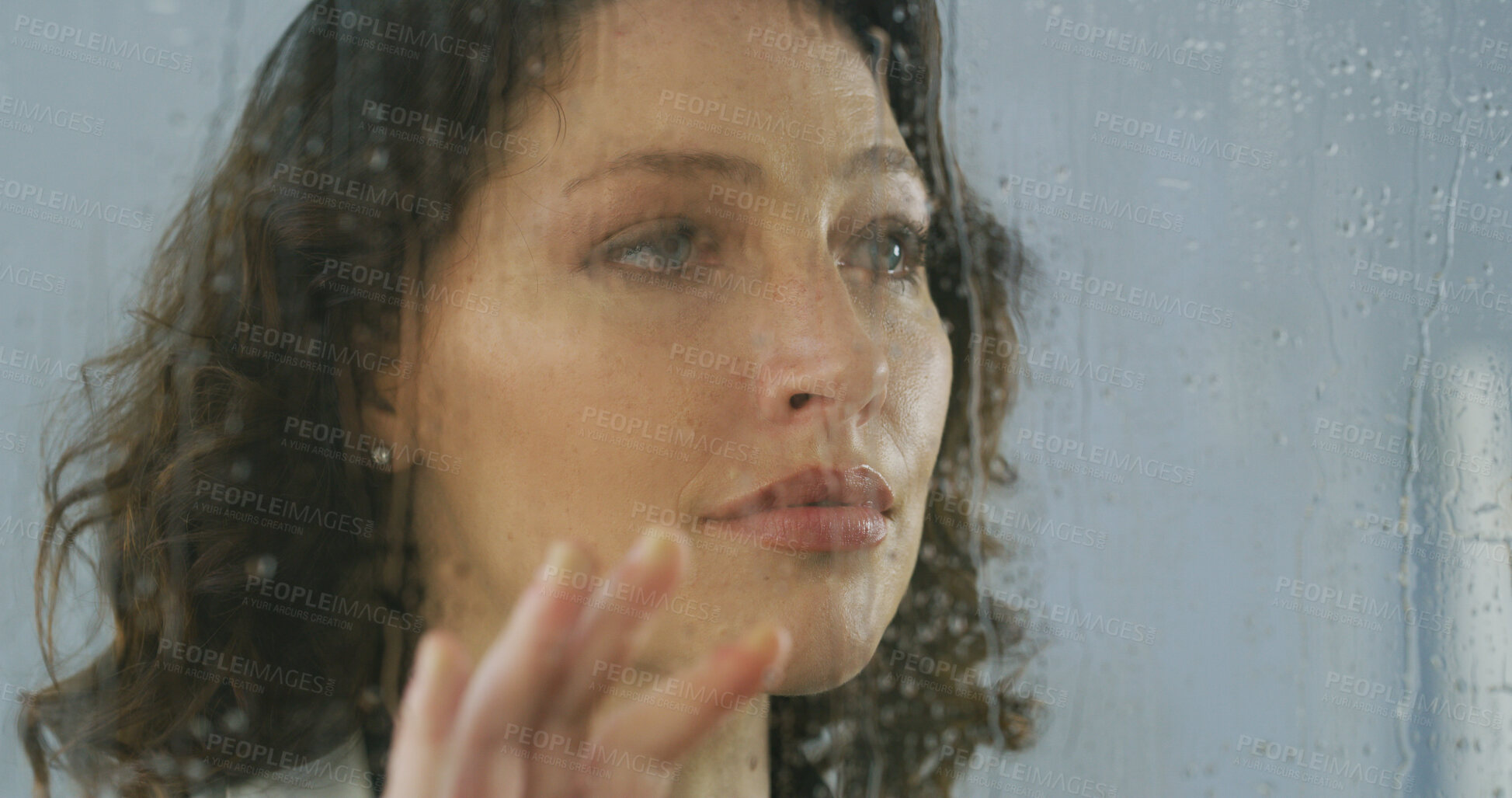 Buy stock photo Rain, thinking and woman at window with depression, sad or broken heart at home. Glass, reflection and unhappy female person with bad memory, psychological trauma or stress for loneliness or anxiety