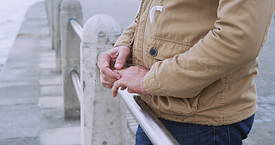 Buy stock photo Hands, wedding ring and thinking with man, closeup and doubt with commitment. Fingers, person and guy in city, relationship and marriage with breakup, divorce and widower with emotion and upset