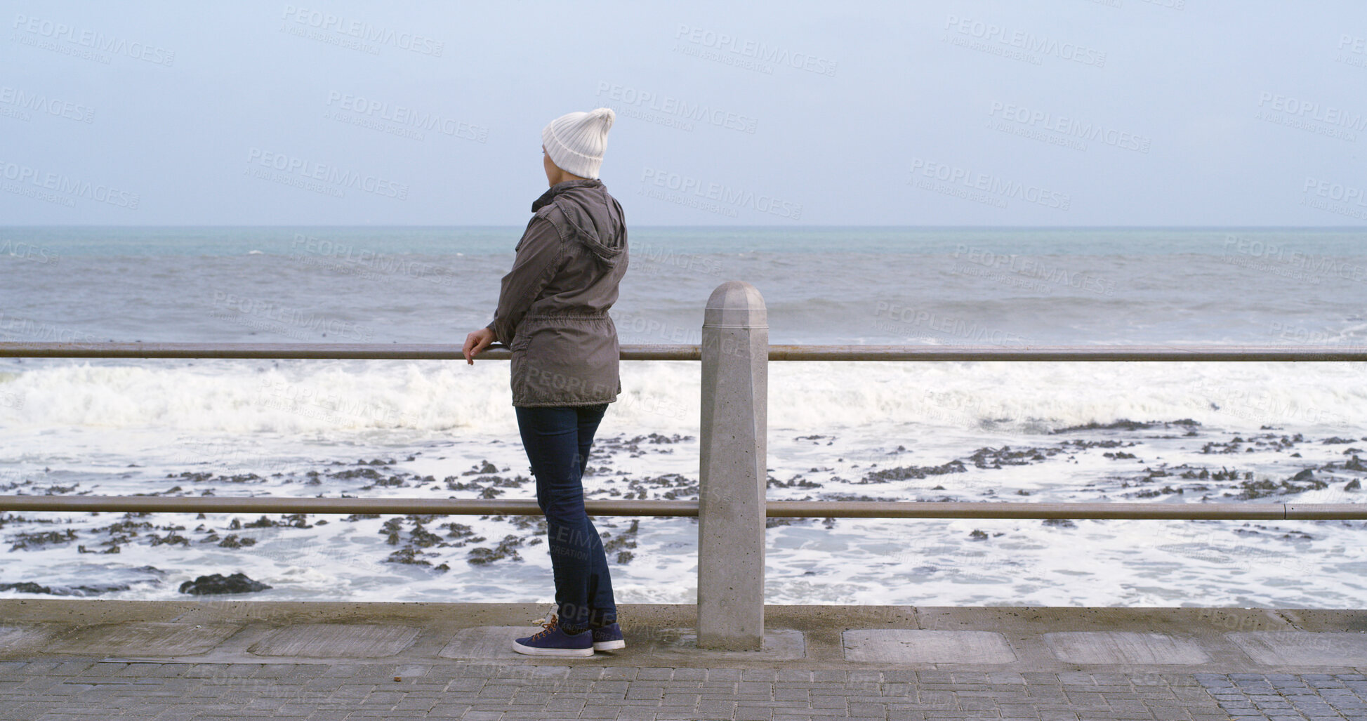 Buy stock photo Back, woman and thinking with outdoor by ocean for relax, planning and reflection on weekend. Female person, mental health and wellness by seaside or water for ideas, memory and mindfulness for break