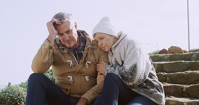 Buy stock photo Support, sad and hug with senior couple in outdoor for comfort, depression and bad news. Communication, anxiety and mental health with elderly man and woman for retirement, bonding and empathy