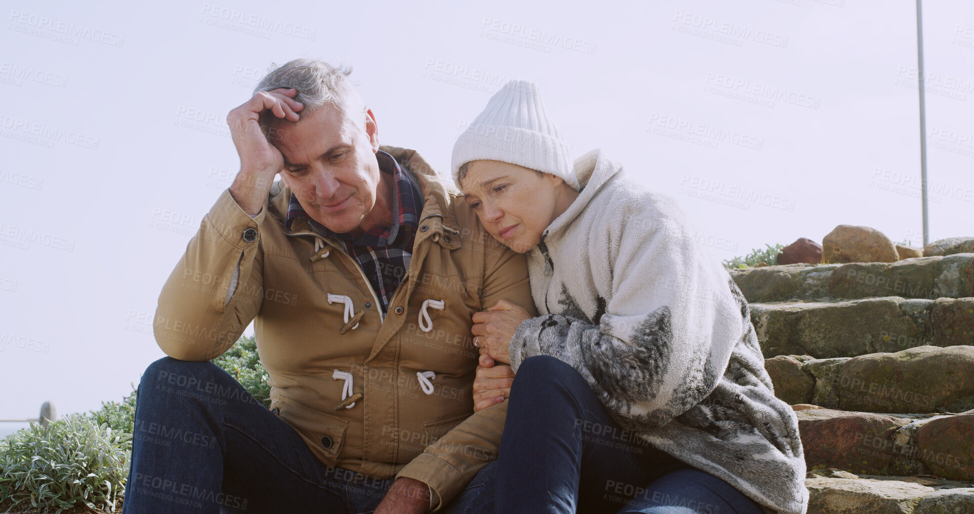 Buy stock photo Support, sad and hug with senior couple in outdoor for comfort, depression and bad news. Communication, anxiety and mental health with elderly man and woman for retirement, bonding and empathy