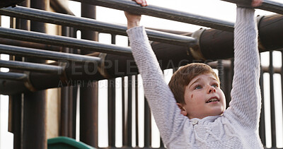 Buy stock photo Boy, child and monkey bars at playground, outdoor and adventure with smile, learning and balance. Kid, happy and exercise with swing on jungle gym at park for challenge, climbing or sunshine in Spain