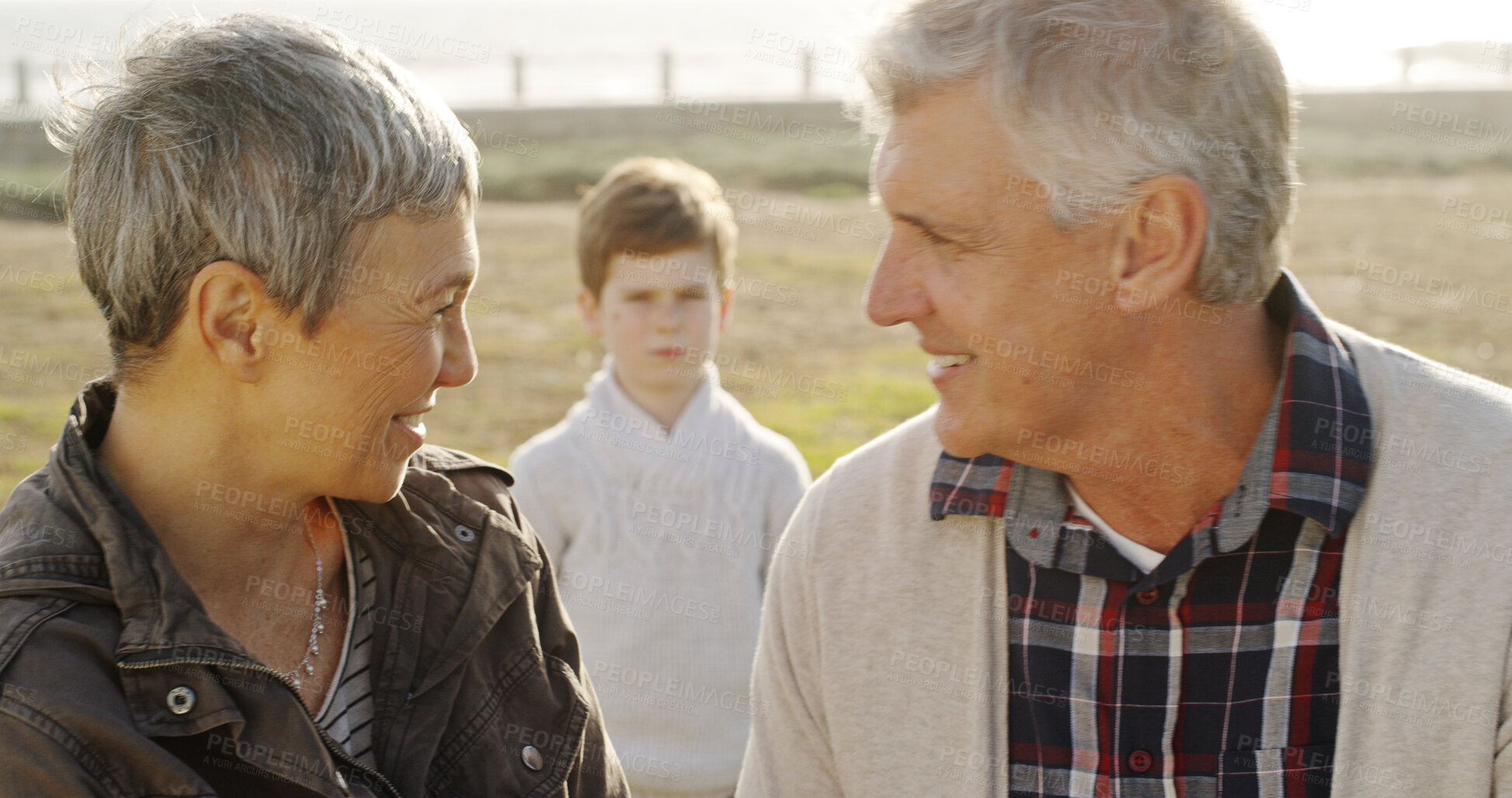 Buy stock photo Child neglect, ignore and grandparents with kid in park for generations gap, mental health and fostering failure. Family Issue, abandoned and adoption with mature man and woman with boy in nature