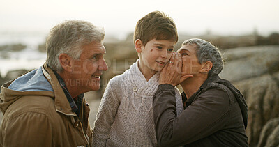 Buy stock photo Grandparents, grandchild and secret for bonding together on beach, outdoor and seashore. Senior people, boy and weekend for whisper, childcare and vacation on winter holiday with family for support
