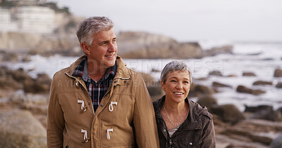 Buy stock photo Walking, holding hands and senior couple by ocean for bonding, relationship and love outdoors. Happy, marriage and man and woman by sea talking for romance, commitment and relax together on weekend