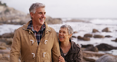 Buy stock photo Happy, laughing and senior couple by ocean for bonding, relationship and love in nature. Walking, marriage and man and woman by sea for romance, commitment and relax together on weekend in winter
