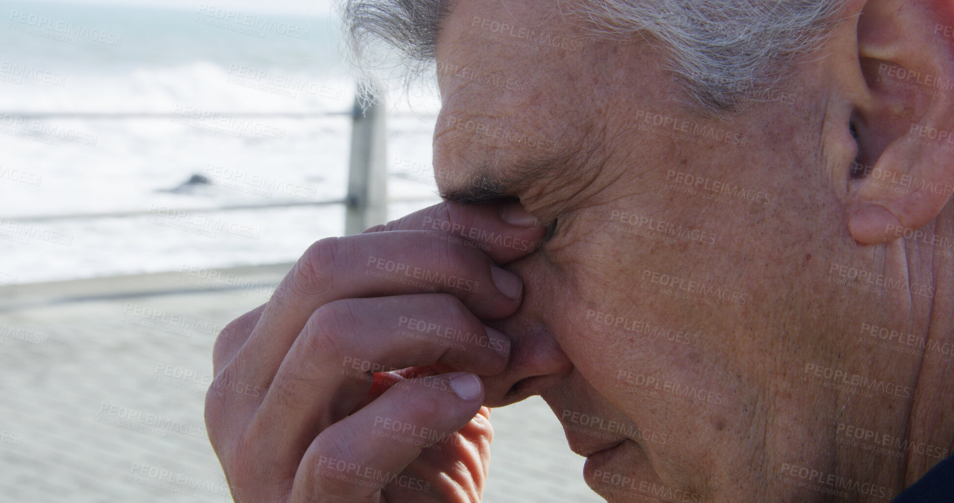 Buy stock photo Senior, man and headache with stress on beach for heat stroke, burnout or fatigue by ocean coast. Mature, male person or tired with migrine, pain or ache for mistake, vertigo or strain in nature