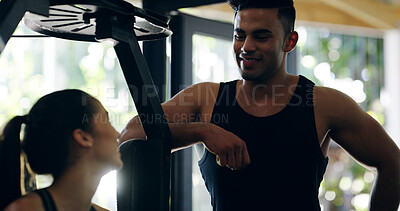 Buy stock photo Happy man, personal trainer and woman with equipment at gym for workout, exercise or training routine. Male person, coach and partner with smile on machine for chest press or fitness at health club