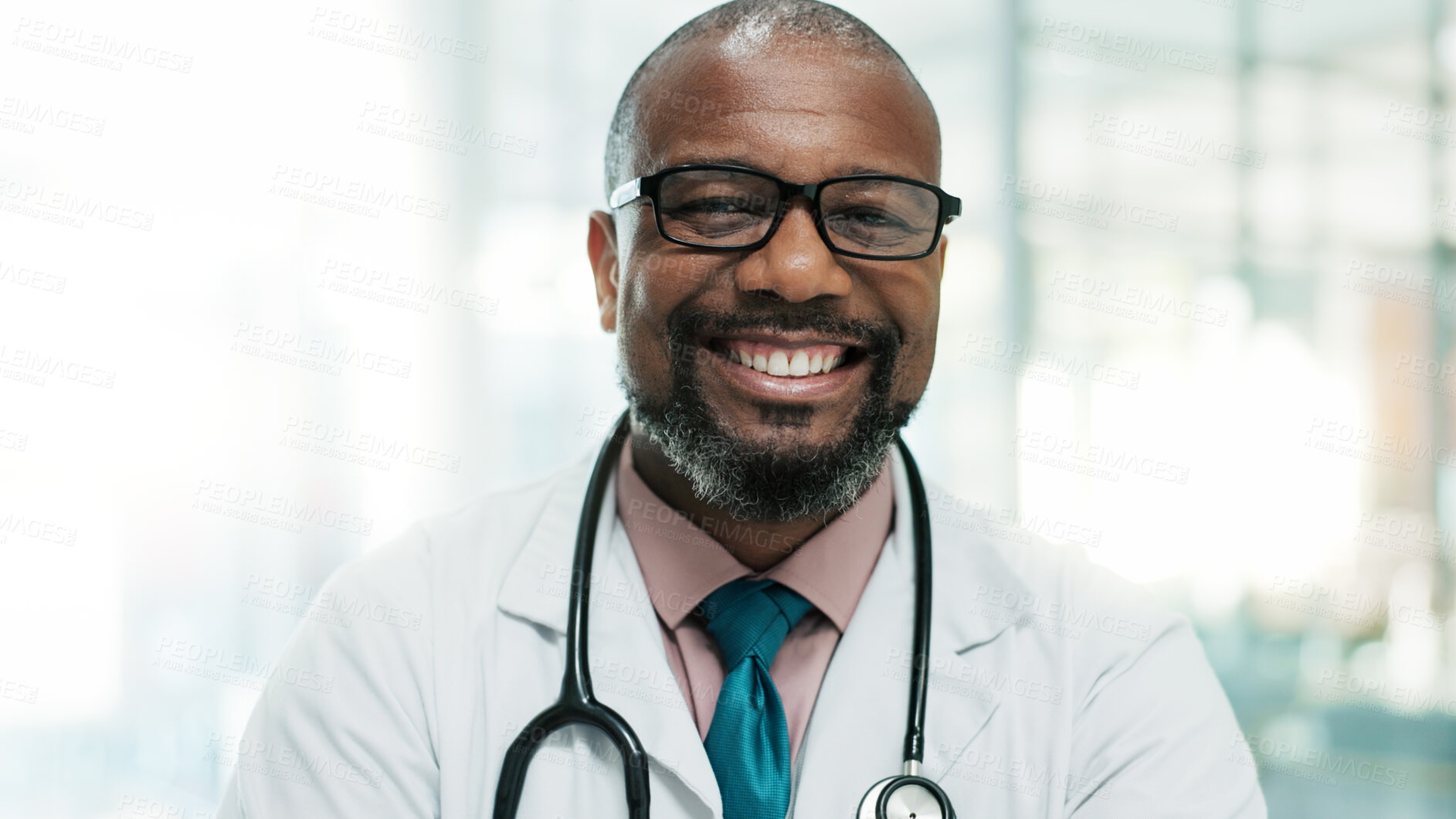 Buy stock photo Portrait, happy black man and mature doctor in hospital for healthcare service, wellness and job. Face, smile and medical professional, physician and surgeon working in clinic with glasses in Rwanda