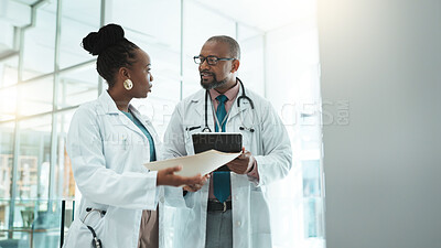 Buy stock photo Teamwork, conversation and doctors with tablet, healthcare and feedback for surgery. Employees, medical and professional in hospital, tech and research with mentor, advice for schedule or digital app