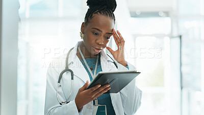 Buy stock photo Black woman, doctor and stress with tablet at hospital on internet for busy schedule and appointment. Female person, employee and worried at clinic for telehealth with bad reviews or patient feedback