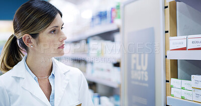 Buy stock photo Woman, pharmacist and shelf for medicine, stock check or inventory inspection in retail store. Pharmacy, person and reading label in shop for medical drugs, healthcare products or thinking of pills
