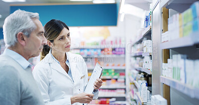 Buy stock photo Senior man, pharmacist and help in pharmacy for medicine, choosing and advice for supplement choice. Elderly person, woman and customer service at shelf for pharmaceutical, decision or expert opinion