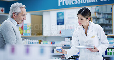 Buy stock photo Pharmacy, tablet and customer with drugs for help, cure or prescription pills in retail store. Medical pharmacist, senior man and woman with technology for consultation, healthcare advice or medicine