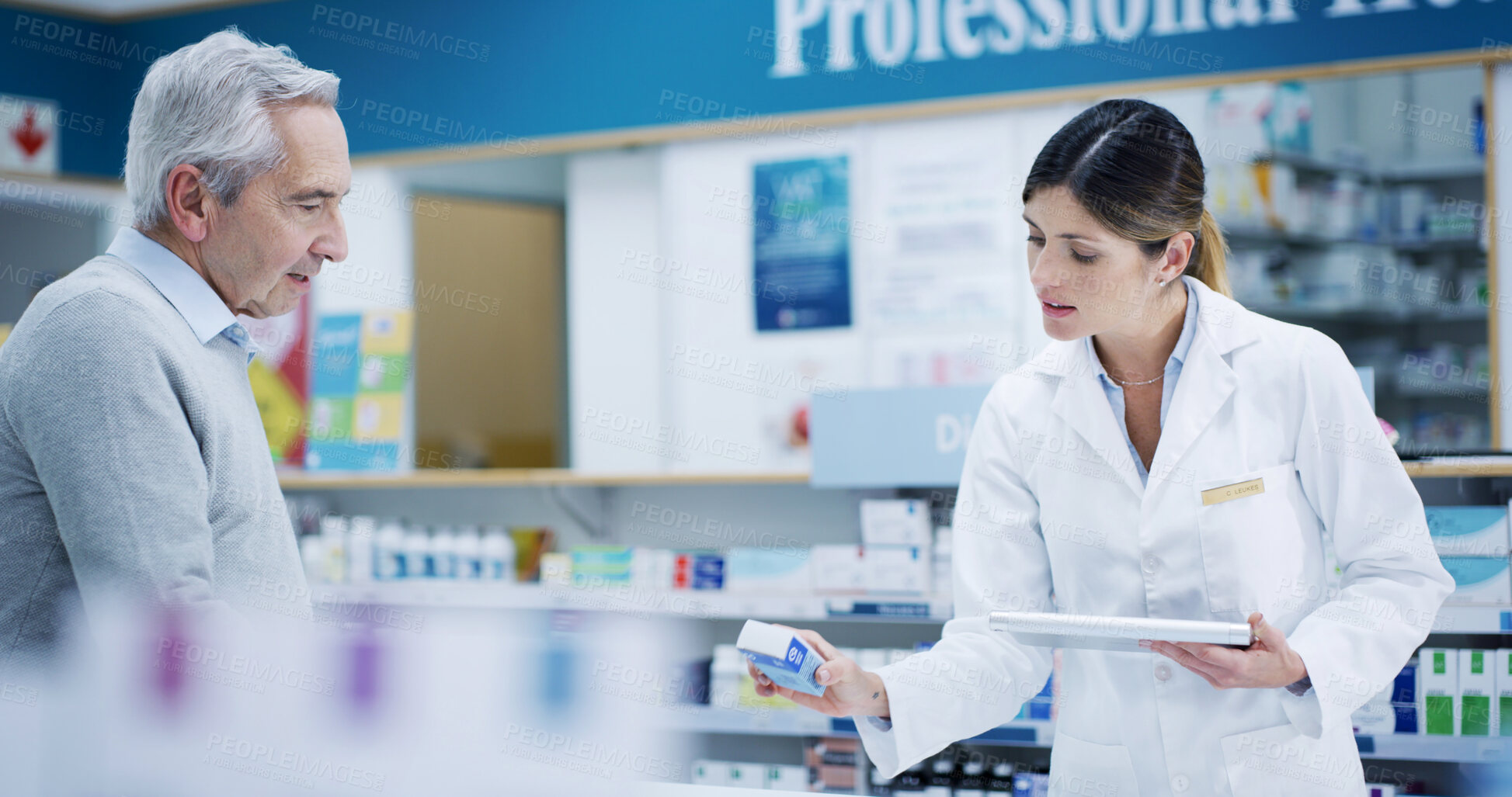 Buy stock photo Pharmacy, tablet and customer with drugs for help, cure or prescription pills in retail store. Medical pharmacist, senior man and woman with technology for consultation, healthcare advice or medicine