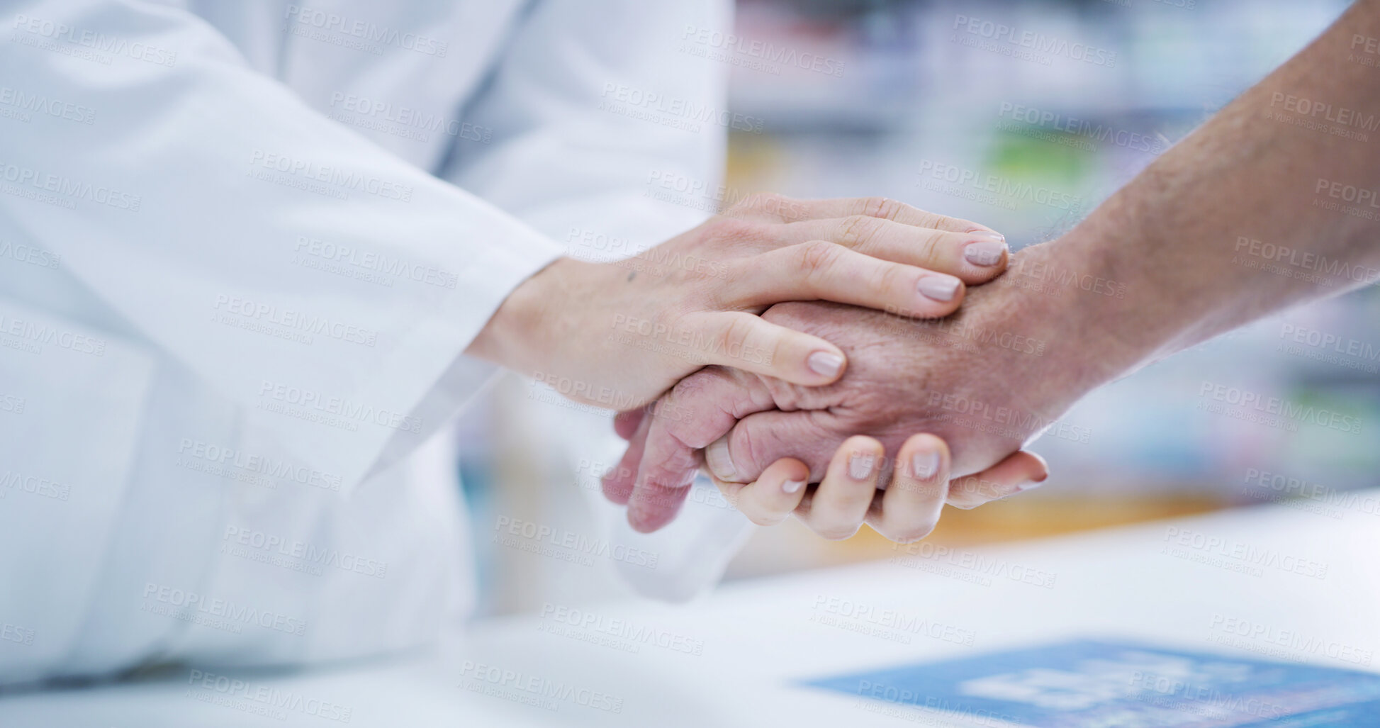 Buy stock photo Support, pharmacist and patient holding hands at counter for help, empathy and elderly healthcare service. Medical advice, comfort and people in pharmacy together for senior care, gratitude and trust