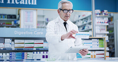 Buy stock photo Mature, pharmacist and man with medication on tablet for inventory check, online order and drugs dispensary. Medical, professional and pills box in pharmacy store for pharmaceutical stock checklist