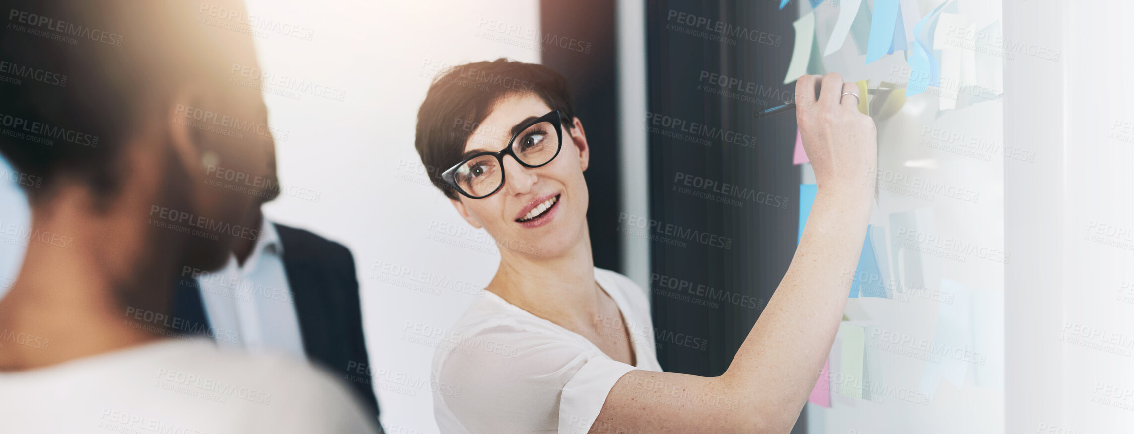 Buy stock photo Shot of a team of colleagues having a brainstorming session at work