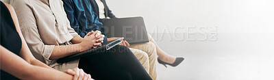 Buy stock photo Shot of a group of businesspeople seated in line while waiting to be interviewed