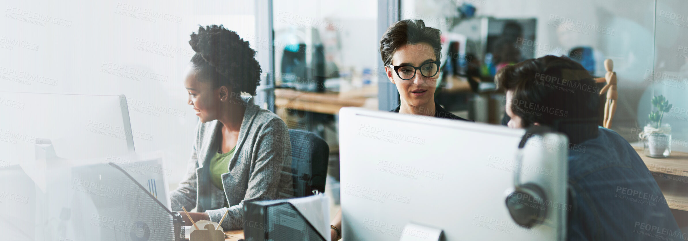 Buy stock photo Shot of two businesspeople talking in the office alongside a third colleague