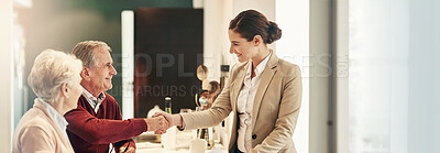 Buy stock photo Shot of a senior couple getting advice from their financial consultant