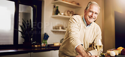 Buy stock photo Shot of a senior man enjoying a glass of wine while preparing dinner in his kitchen