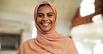Smile, islam and portrait of woman in mosque for praying, worship and muslim religion. Eid Mubarak, ramadan and spiritual with person wearing hijab in Saudi Arabia for culture, peace and faith 