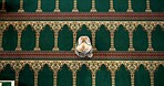 Muslim woman, above and mosque with pray for dua, thikr or holy religion in salah at temple. Top view, female person or arab in islam for spiritual belief, faith or worship of allah at indoor masjid