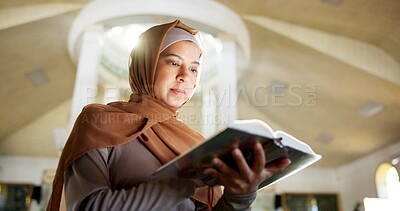 Buy stock photo Muslim woman, reading and mosque with quran or holy book for recitation, praying or dua in temple. Female person, hijab or arab with islamic testament, scripture or word of god for faith or belief