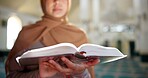 Muslim woman, hands and reading with quran at mosque for recitation, praying or dua in temple. Female person, hijab or arab with islamic testament, holy scripture or book of god for faith or belief
