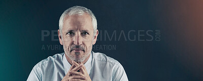 Buy stock photo Studio portrait of a mature businessman against a dark background