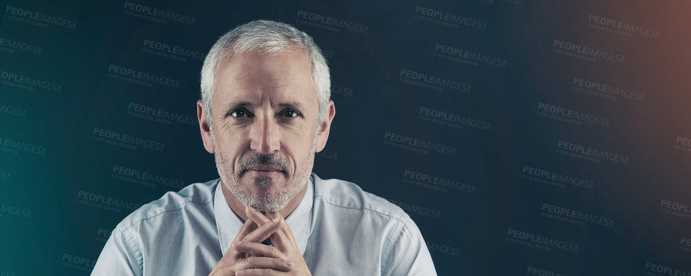 Buy stock photo Studio portrait of a mature businessman against a dark background